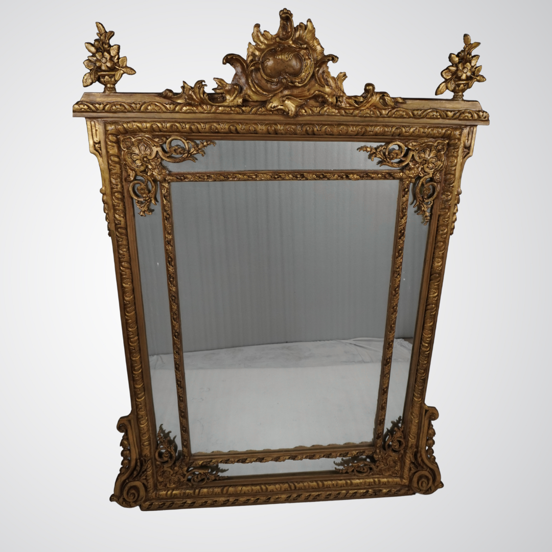 Exquisite Rococo Giltwood Wall Mirror with Ornamental Crest