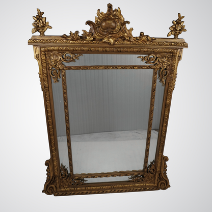 Exquisite Rococo Giltwood Wall Mirror with Ornamental Crest