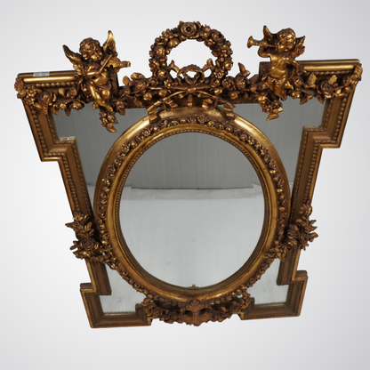 Exquisite Antique Gilded Mirror with Oval Center and Cherub Detailing